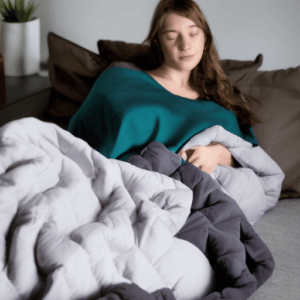 A woman covered with weighted blanket