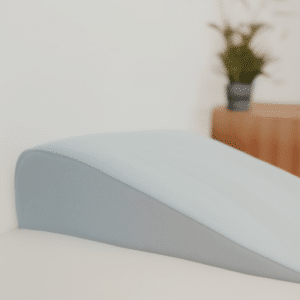 A wedge pillow on the bed