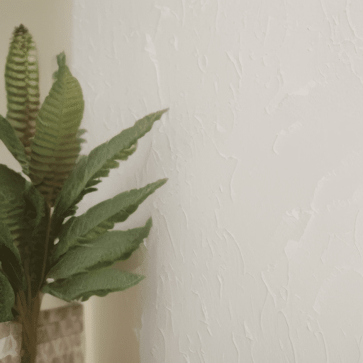 Indoor plants near a textured wall