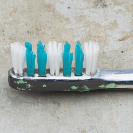 Old toothbrush for cleaning a paint sprayer