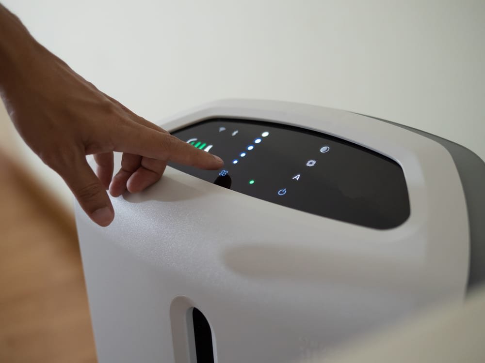 device used to remove airborne contaminants from enclosed spaces