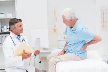 doctor discussing with eledrly patient