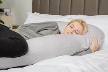 woman hugging total body cushion
