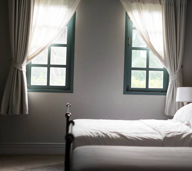a bedroom with blackout curtains