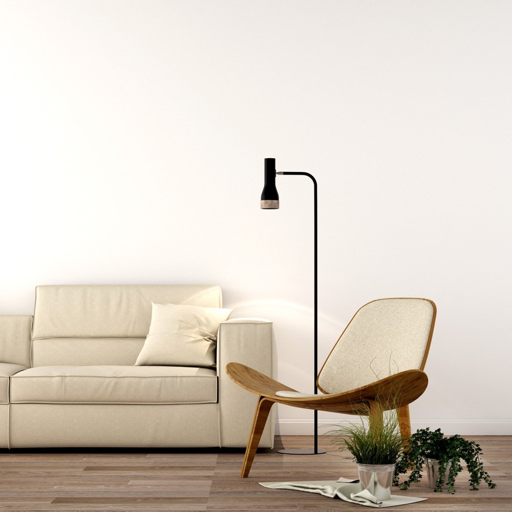 a cosy living room with a floor lamp