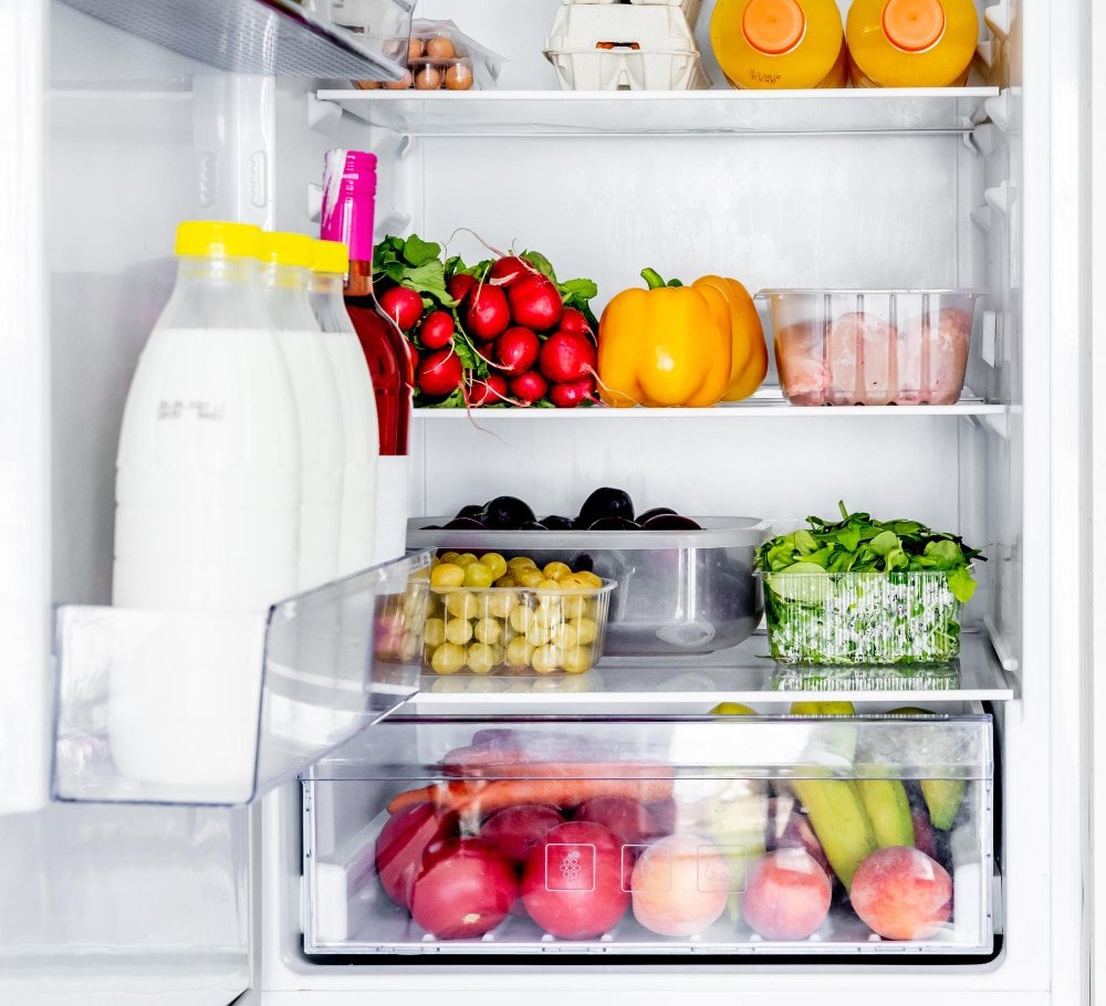 a fridge with fruits and vegetables