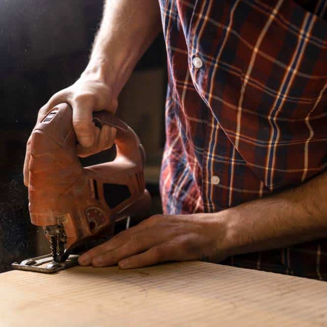 a man working with wood