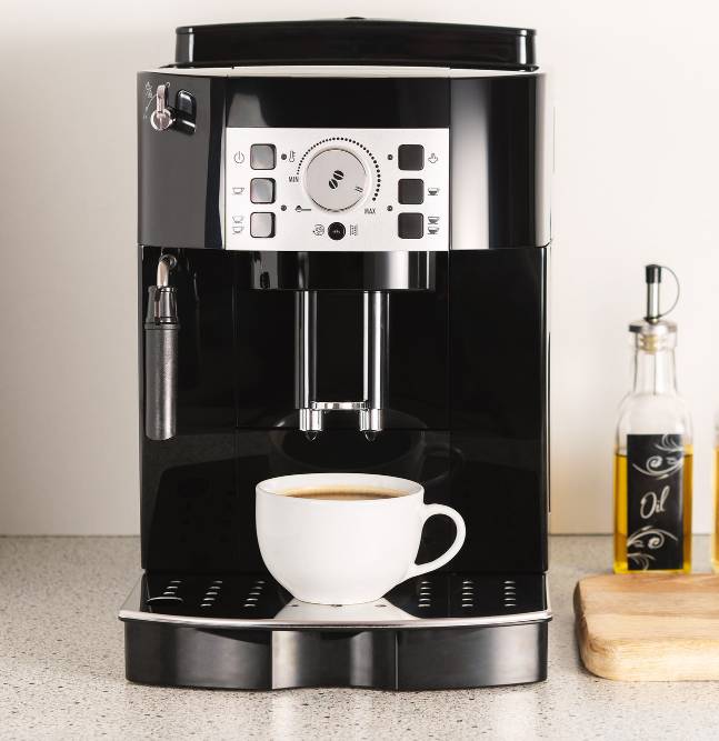 a modern espresso coffee machine with a cup