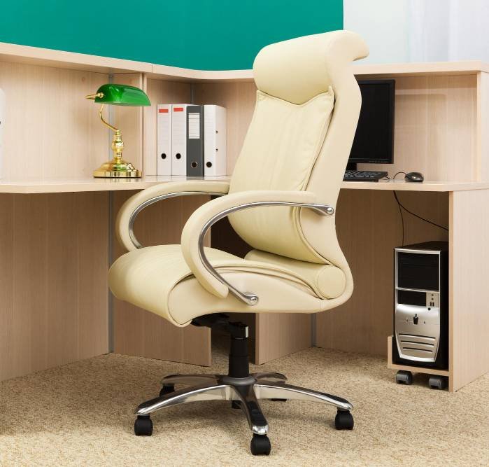 a modern office with a cosy chair