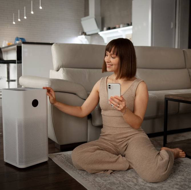 a young woman using home technology